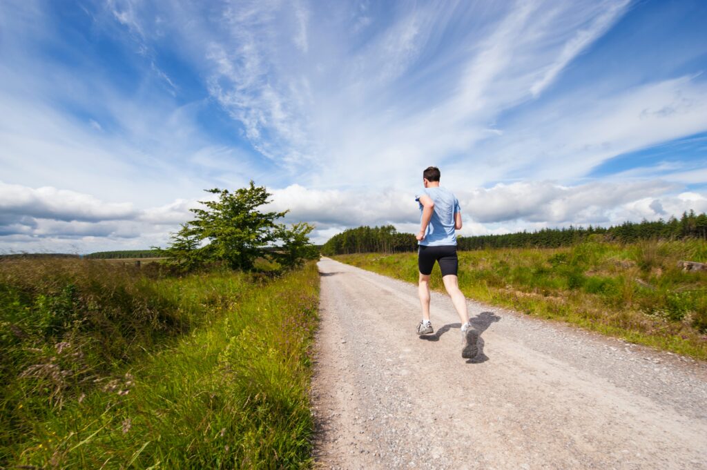 club standards-man running in countryside